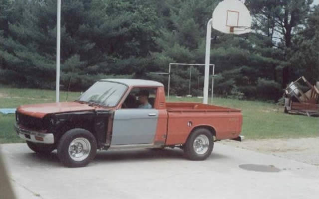 Mom snapped a pic of me driving it up the driveway. I guess its just a mom thing. You can see really well how we replaced the drivers rocker panel in this one.